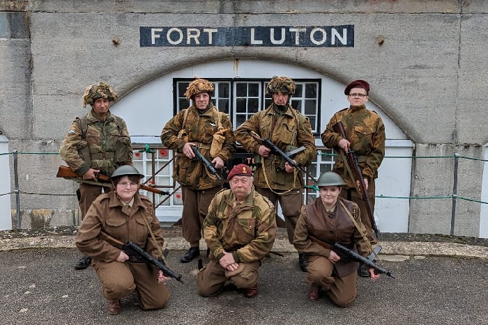 Reenactors in WW2 British Paratrooper uniforms in front of a bunker